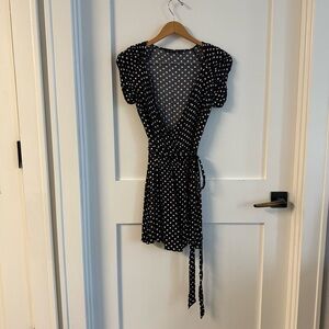Black and White Polka Dot wrap front romper with self tie and rouched sleeve
